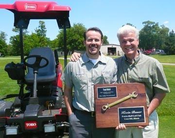 2012 Technician of the Year winner Kevin Bauer, left, and his father, Don. Pictured on the front page is 2013 winner Brian Sjogren.