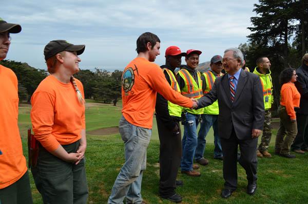 San Francisco Mayor Eddie Lee, right, greets labor union members during the dedication of Mario de la Torre Training Academy at Gleneagles Golf Course.