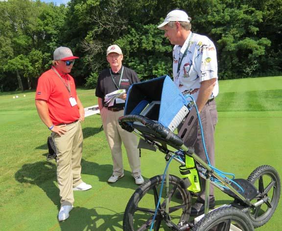 Todd Troy of Muirfield Village Golf Club listens as Ed McCoy, Ph.D., of Ohio State and Barry Allred, Ph.D., of the USDA (left to right) discuss ground-penetrating radar.
